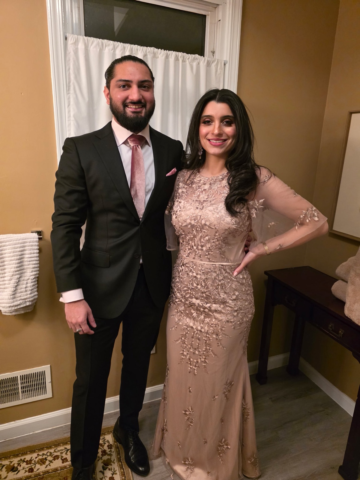 Jennifer and Samir dressed up for an evening out